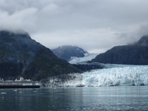 Cruise ship in front of glacier for size comparison