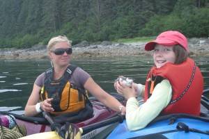 One of our cool sea kayak guides giving Annie a science lesson